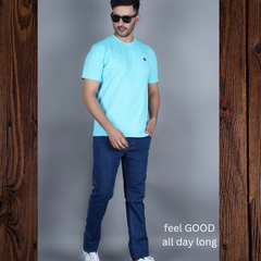 men wearing pure cotton half sleeve round neck t shirt sky blue light blue color breathable everyday wear premium comfort paired with dark blue premium cotton stretch EPG jeans