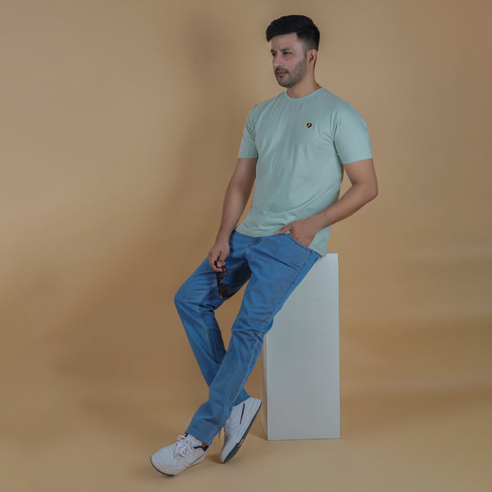men wearing pure cotton half sleeve round neck t shirt pistachio light yellow green color breathable everyday wear premium comfort paired with premium cotton stretch light blue color EPG jeans