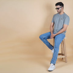 men sitting on stool wearing pure cotton half sleeve round neck t shirt charcoal grey dark grey color breathable everyday wear premium comfort no shrink no sag holds shape