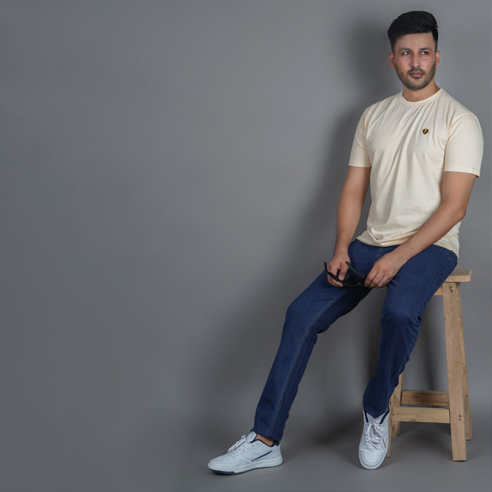 lifestyle shot of men wearing pure cotton half sleeve round neck t shirt california peach breathable everyday wear premium comfort also wearing EPG jeans in dark blue color