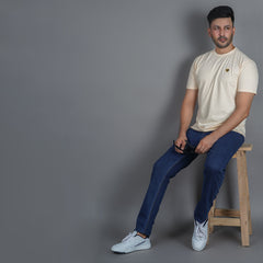 lifestyle shot of men wearing pure cotton half sleeve round neck t shirt california peach breathable everyday wear premium comfort also wearing EPG jeans in dark blue color