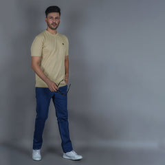 men wearing pure cotton half sleeve round neck t shirt beige breathable everyday wear premium comfort paired with EPG premium jeans
