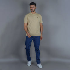 men wearing pure cotton half sleeve round neck t shirt beige breathable everyday wear premium comfort wearing EPG comfort stretch jeans
