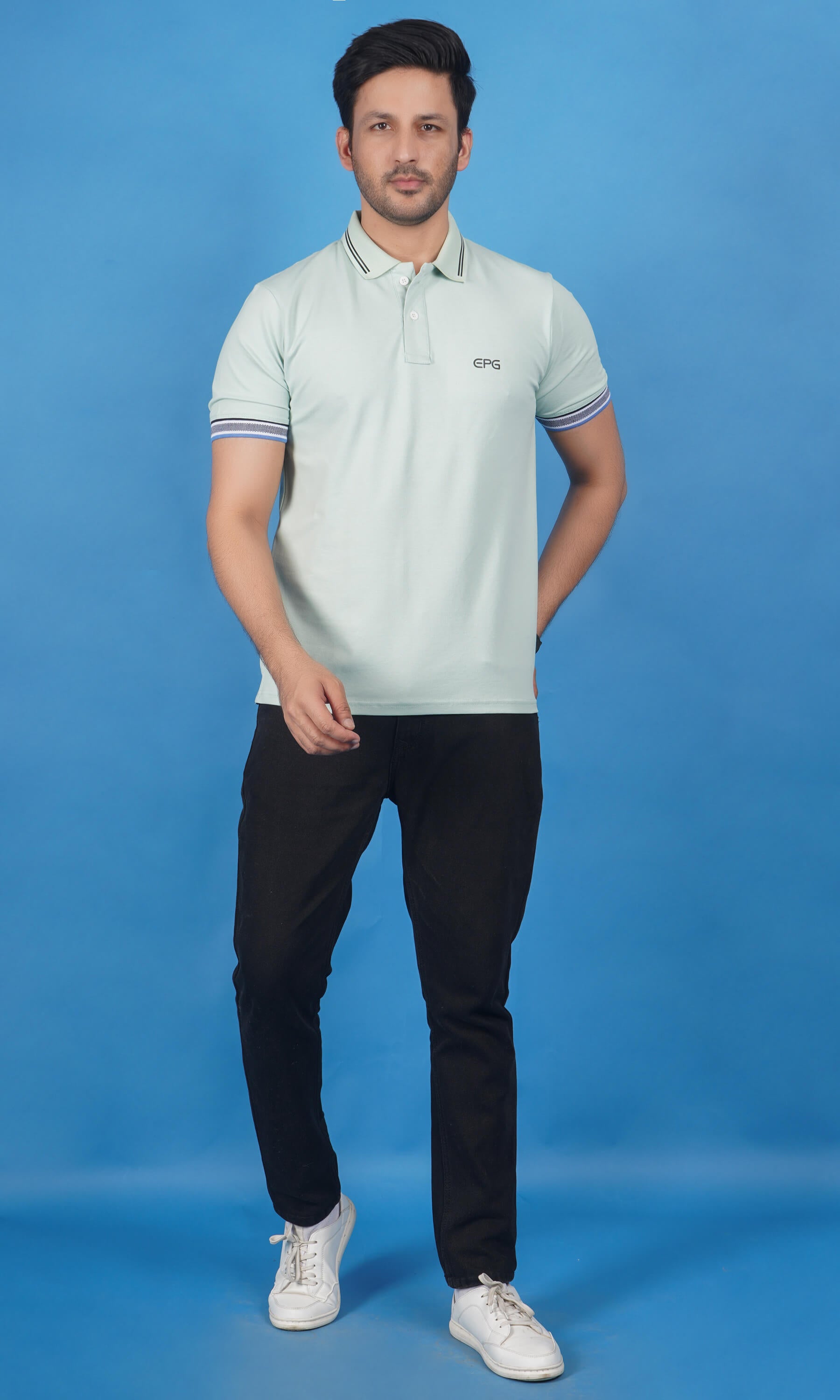 men wearing cotton lycra half sleeve polo t shirt pistachio soft green color breathable everyday wear premium comfort paired with cotton stretch black color EPG jeans