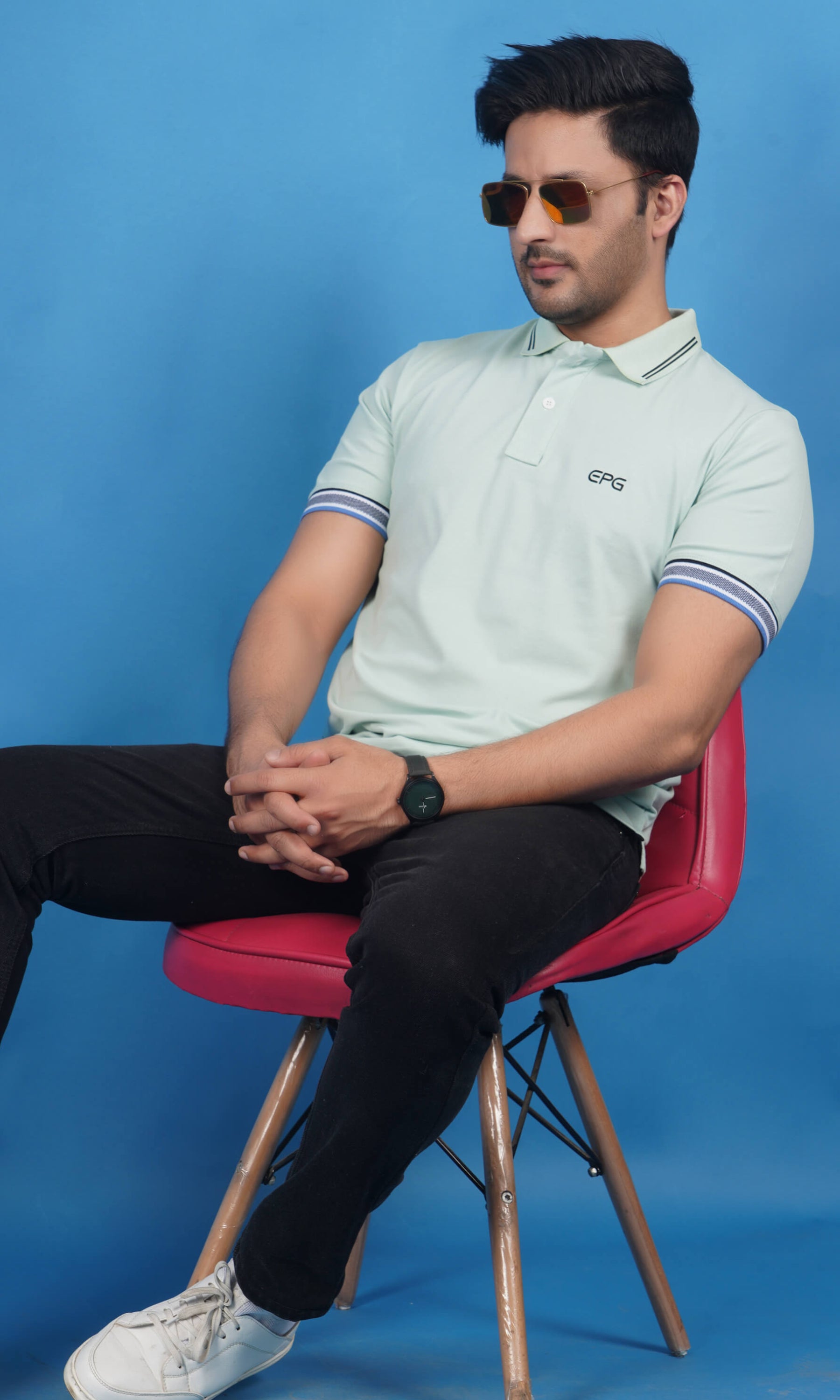 men wearing cotton lycra half sleeve polo t shirt pistachio soft green color breathable everyday wear premium comfort paired with black color EPG jeans